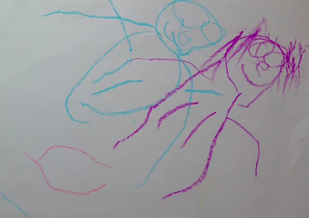 A child participant drew themselves smiling while playing the game